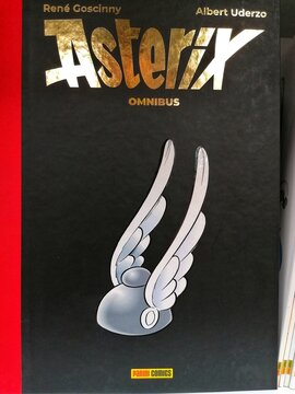Rome, Italy - August 5, 2026, detail of the book Asterix omnibus. Vol. 1, by Ren&eacute; Goscinny (Author), Albert Uderzo (Author), Panini Comics, 2023, on a bookstore shelf.