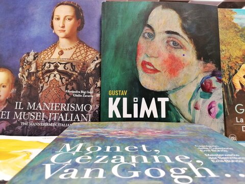 Rome, Italy - September 20, 2025, detail of books on the painter Gustav Klimt and Impressionists such as Claude Monet, Paul C&eacute;zanne, and Vincent van Gogh.