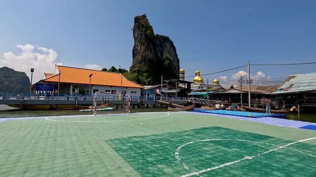 Panyee Island or Koh Panyi is a village built on stilts in Phang Nga Bay and is a Muslim fishermen island - Famous The floating soccer fields in Phang nga Thailand