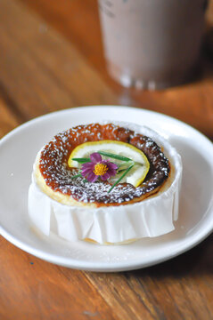 cheesecake or basque cheesecake , piece of cake or lemon cheesecake oe cheesecake with lemon topping