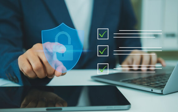 Cybersecurity data protection checklist on laptop businessman verifying secure access privacy compliance risk management digital trust and enterprise information safety.