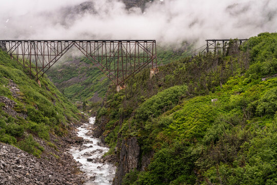 Historic, broken railway bridge near Skagway, Alaska