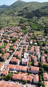 Aerial panorama of Prato under clear summer morning light.