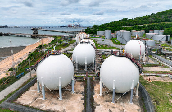 Industrial gas storage tank. LNG or liquefied natural gas storage tank. Gas tank in petroleum refinery. Natural gas storage industry. Energy infrastructure and petroleum reserves in global market.