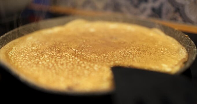 Close-Up of Freshly Cooked Golden Pancake in Frying Pan with Steam Rising, Homemade Breakfast Cooking
