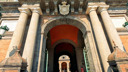 Obraz premium Grand Stone Archway Entrance of the Royal Palace in Naples