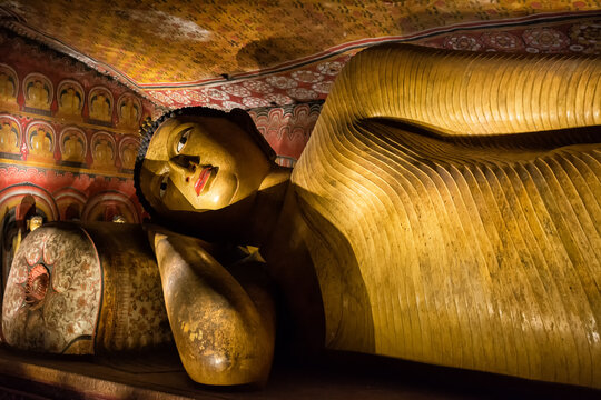 Golden Reclining Buddha Statue Inside Ancient Sri Lankan Cave Temple of Danbulla