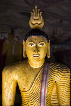 Ancient Golden Buddha Statue Inside a Sacred Sri Lankan Cave Temple of Dambulla