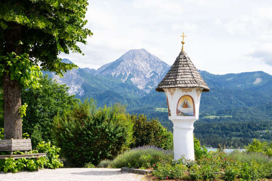 Faaker See Wayside Shrine with Mittagskogel Mountain in Carinthia, Austria