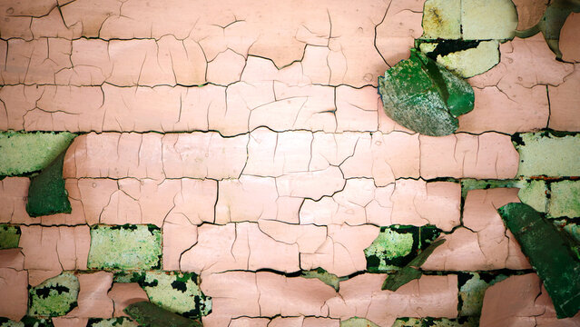 old cracked paint. background of the old wall. paint will peel off the wall. retro vintage theme. for text. concept of repair, remove, dismantling, reconstruction. old cracked plaster on the wall