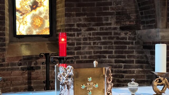 Serene ambience inside the Modena cathedral crypt, showcasing San Geminiano's stone tomb and exquisite ancient frescoed walls of Modena city in Italy