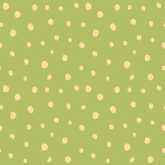 Seamless scattered polka dot pattern with pale yellow spots on olive green background hand drawn illustration. © yuliya_derbisheva
