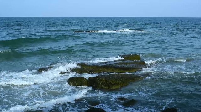 The seaside has sandy beaches and strong waves.