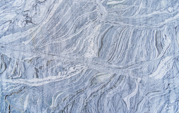 Texture of a natural stone with layer structure as a background
