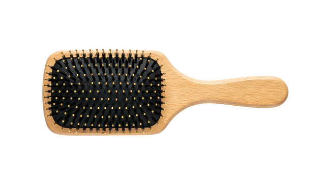 Natural wood hairbrush with soft black bristles and gold tips, perfect for detangling and styling on transparent background.