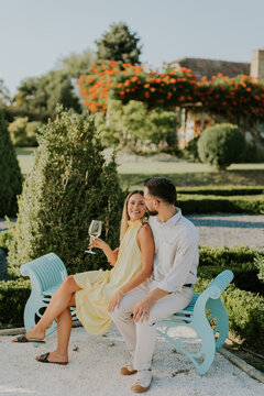 Couple enjoying a sunny afternoon in a beautiful garden setting