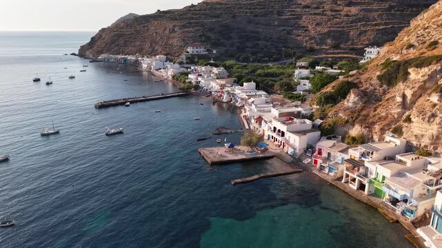 Aerial view of Klima traditional fishing village at sunset, Milos Island, Greece