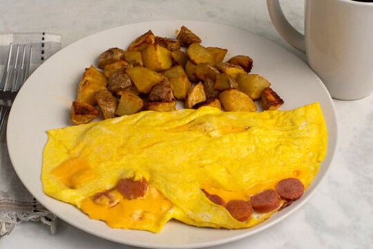 hot dog and cheese omelette with home fries