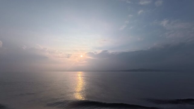 Dynamic open sea background footage with clear blue sky gradient and majestic light reflection