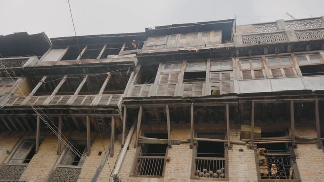 Centuries-old traditional Newari houses in Bhaktapur, Nepal, featuring beautifully preserved brick facades, carved wooden windows, and timeless architecture in one of the country's oldest historic cit
