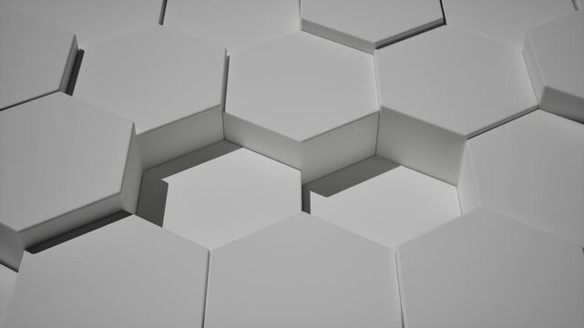 CGI of 3D hexagonal grid patterns in white and grey. Camera explores the honeycomb surface at various angles, ideal for tech or corporate backgrounds. Rendered in Unreal Engine.