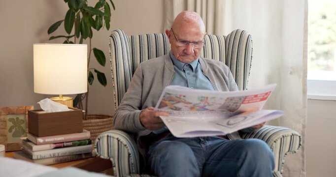 Newspaper, relax and retirement with old man in living room of home for break or information. Article, glasses and reading with senior person on chair in apartment for media publication or report