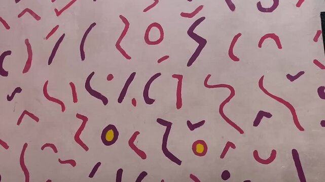 abstract art or doodle patterns with curved lines and dots decorating the wall