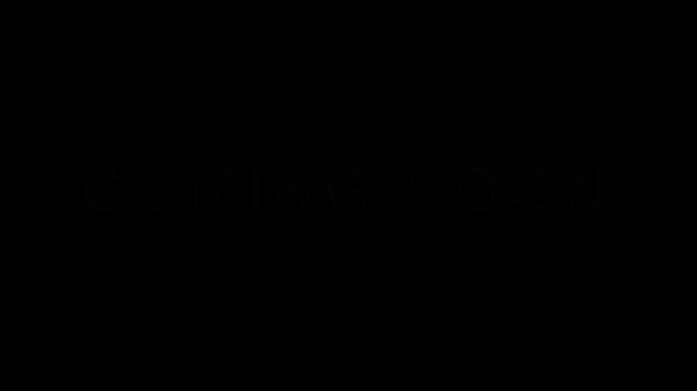Minimalist white glowing coming soon text animation with flickering effect on black background