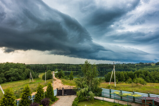 Dramatic Storm Front Over Rural Dacha Estate with Forest Lake, Central Russia