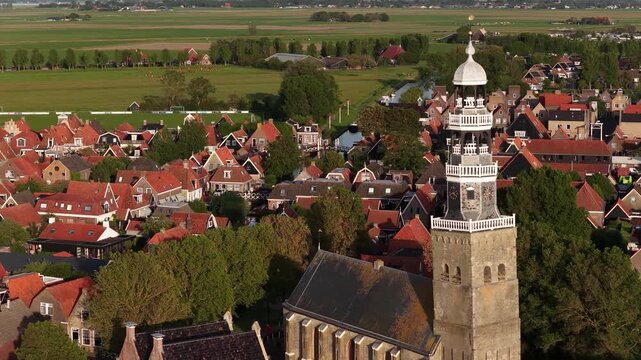 Scenic aerial view of hindeloopen town and its historic church tower in friesland