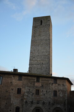 San Gimignano, Italy 03.04.2020: Town Hall (also known as the Palazzo del Popolo or Palazzo Nuovo del Podest&agrave;) and the Torre Grossa in San Gimignano