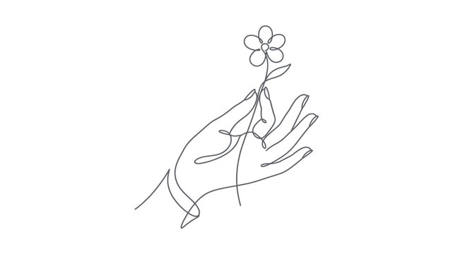 Hand holding a small flower.