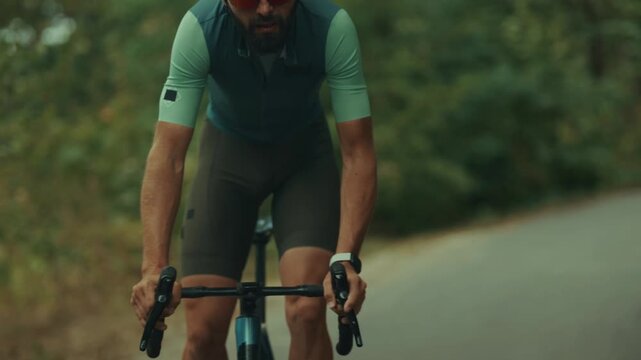 Cyclist Riding Road Bicycle Fast On Asphalt Path. Athlete Training. Active Lifestyle