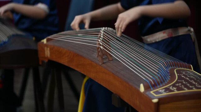 High School Students Playing Gu Zheng Traditional Chinese Zither Musical Instrument in Music Class, Cultural Education and Musicians Rehearsing