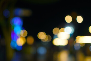 Fototapeta premium Abstract blurred city lights at night with bokeh effect
