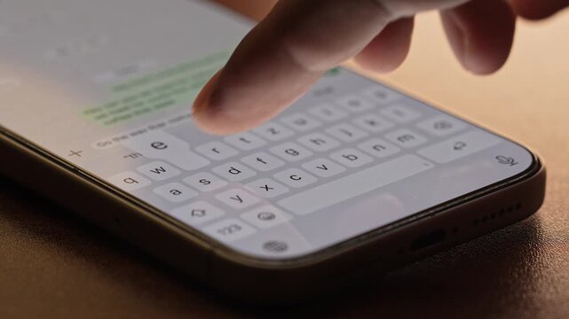 Man hands chatting and typing on smartphone macro closeup. Unrecognizable human typing text message tapping touchscreen keyboard using whatsapp application a social media