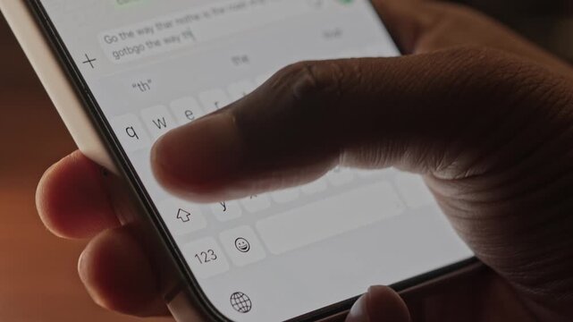 Man hands chatting and typing on smartphone macro closeup. Unrecognizable human typing text message tapping touchscreen keyboard using whatsapp application a social media