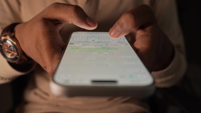 Man hands chatting and typing on smartphone macro closeup. Unrecognizable human typing text message tapping touchscreen keyboard using whatsapp application a social media