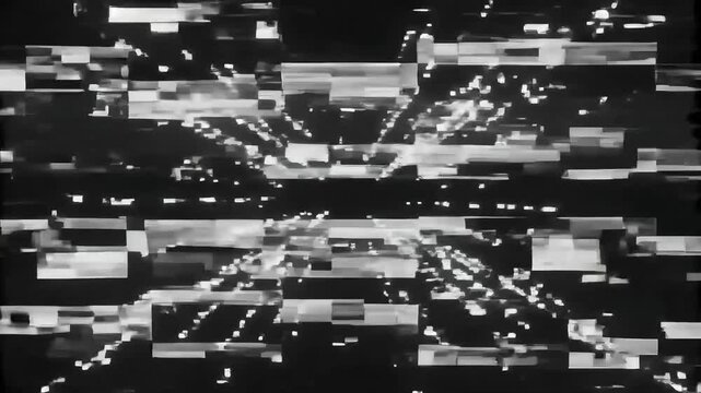 White digital glitch artifacts and noise on black background.