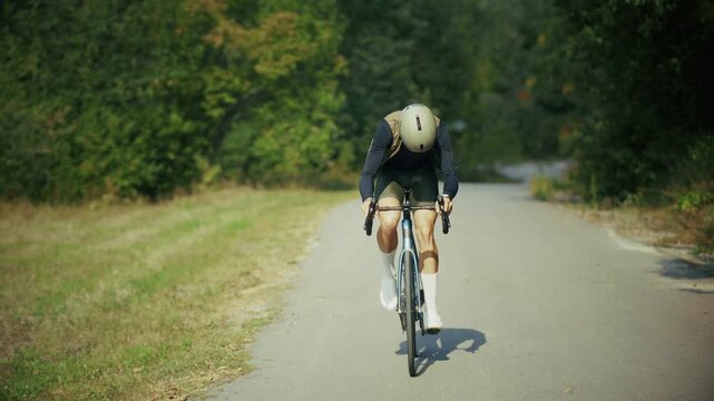 Cyclist Riding Road Bicycle On Asphalt Path. Cycling Workout. Active Lifestyle 