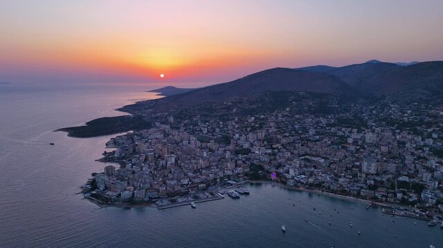 Aerial footage of Saranda at sunset, Albania. Sarand&euml; is a coastal city on the Ionian Sea and the unofficial capital of the Albanian Riviera. 