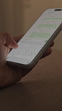 Man hands chatting and typing on smartphone macro closeup. Unrecognizable human typing text message tapping touchscreen keyboard using whatsapp application a social media