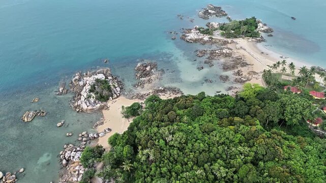 Aerial Drone View of Teluk Karang Beach Sungailiat Bangka Featuring Granite Islets Crystal Clear Turquoise Water Tropical Coastline and Peaceful Paradise