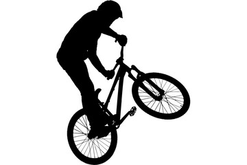 Obraz premium Silhouette of a mountain biker performing a wheelie. Extreme cyclist doing a stunt trick.