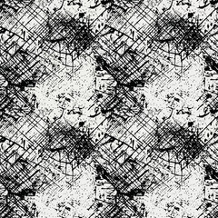 Obraz premium A seamless pattern of black ink splatters on white paper