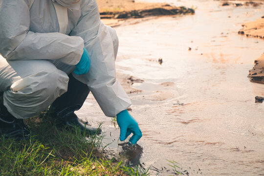 Environmental technician performing laboratory analysis of water samples to monitor pollution.