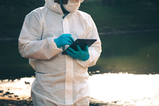 Expert technicians conduct water quality checks and analysis, recording data on tablets.อ
