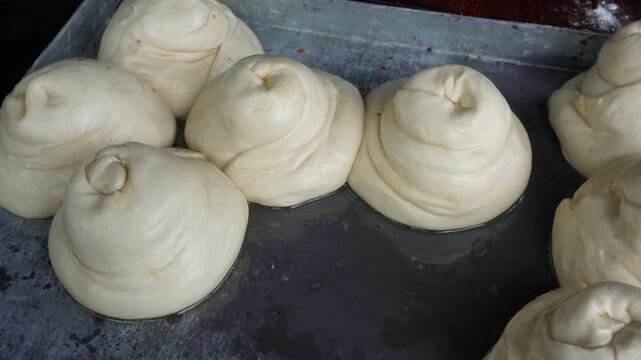 Roti canai dough balls ready for fresh preparation
