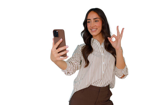 Woman taking selfie, smiling happily and showing okay sign, expressing approval and success, transparent background