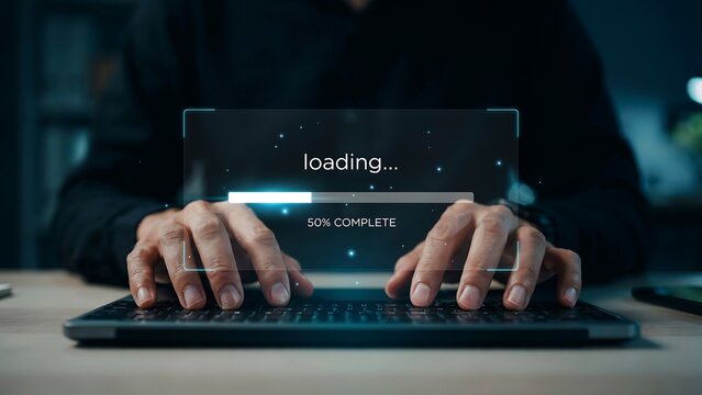 Person typing on laptop with loading screen. Digital progress bar on computer interface.